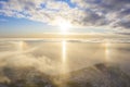 Aerial view White clouds in blue sky with solar halo. Top view. View from drone. Aerial bird`s eye view. Aerial top view cloudsca