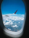 Clouds and sky from airplane window view. White cumulus clouds formation in blue sky. Beauty white cloudy on blue sky with soft Royalty Free Stock Photo