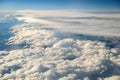 Aerial view of white puffy clouds viewed from an airplane Royalty Free Stock Photo