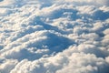 Aerial view of white puffy clouds viewed from an airplane Royalty Free Stock Photo