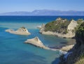 Aerial view on of white rock steep cliff volcanic bay of Cape Drastis and Peroulades area with tropical deep turquoise