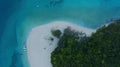 The aerial view white sand beach tropical with seashore as the island in a coral reef ,blue and turquoise sea Amazing nature Royalty Free Stock Photo