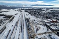 Aerial view of Whitefish, Montana on a cloudy winter day with the Rockies n the background