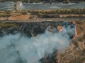 Aerial view of wildfire, spreading flames of forest fire. Natural disaster due to extreme heat and climate change