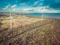 Aerial view of wind farm, ocean and agricultural fields in Australia. Image has a retro feel. Royalty Free Stock Photo