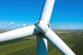 Aerial view of wind turbine rotor with blades on modern wind farm from drone pov Royalty Free Stock Photo