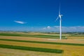 Aerial view of wind turbine. Windmills at harvest time, fields from above. Agricultural fields on a summer day. Renewable Energy Royalty Free Stock Photo