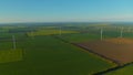 Aerial view wind turbines producing alternative energy for sustainable industry. Royalty Free Stock Photo