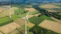 Aerial view of wind turbines windmills in farming fields. Alternative ecological energy production in Germany