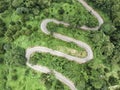 Aerial view of winding asphalt road for background.Scenic view of Sharp curve road on the mountain by drone safty drive and travel Royalty Free Stock Photo