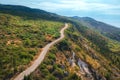 Aerial view of winding mountain road, blue sky at sunrise Royalty Free Stock Photo