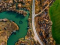 Aerial view of winding river and road in golden colored fall forest Royalty Free Stock Photo