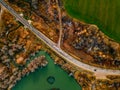 Aerial view of winding river and road in golden colored fall forest Royalty Free Stock Photo