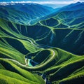 An aerial view of a winding road cutting through mountains or a coastal depicting