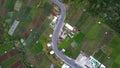 Aerial view, winding road in Tawangmangu on the edge there are plantation fields
