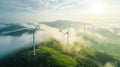 Aerial view of windturbine renewable energy farm winthwindmills on a foggy morning