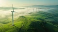 Aerial view of windturbine renewable energy farm winthwindmills on a foggy morning