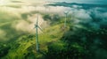 Aerial view of windturbine renewable energy farm winthwindmills on a foggy morning