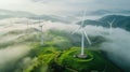 Aerial view of windturbine renewable energy farm winthwindmills on a foggy morning