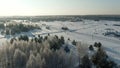 Aerial view: winter forest. Snowy tree branch in a view of the winter forest. Winter landscape, forest, trees covered
