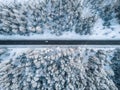 Aerial view of winter road and forest with snow covered trees in Finland Royalty Free Stock Photo