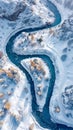 Aerial view. Winter scene of river winding through snow-covered forest. River is frozen and covered in white snow Royalty Free Stock Photo