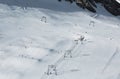 Aerial view of winter slopes of Alp mountains in sunny Austria