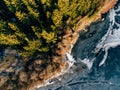 Aerial view of the winter snow forest and frozen lake from above captured with a drone in Finland. Royalty Free Stock Photo