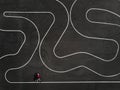 Aerial view of a woman riding a bike on a parking lot Royalty Free Stock Photo