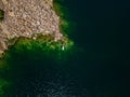 Aerial view on woman on sup board with paddle in the lake Royalty Free Stock Photo