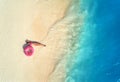 Aerial view of woman with swim ring on the sandy beach Royalty Free Stock Photo