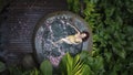 Aerial view of Woman in yellow bikini relaxing in hot tub in tropical. Royalty Free Stock Photo