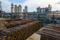 Aerial view of wood processing factory with stacks of lumber at plant manufacturing yard