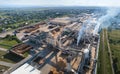 Aerial view of wood processing factory with stacks of lumber at plant manufacturing yard