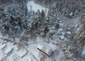 Aerial view of wooden barn covered with snow in Finland. Royalty Free Stock Photo
