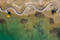 Aerial view of wooden path over turquiose lake colour. Drought. Drone top view Royalty Free Stock Photo