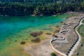 Aerial view of wooden path over turquiose lake colour. Drought. Drone top view Royalty Free Stock Photo