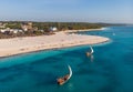 Aerial view of wooden sail boats near Wide White Coastal Beach Line in Kendwa village, Zanzibar Royalty Free Stock Photo