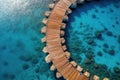 Aerial view of a wooden walkway in the turquoise ocean. Travel concept Royalty Free Stock Photo