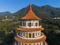 Aerial view of Wuji Tianyuan Temple by drone in Tamsui, New Taipei City, Taiwan. Beautiful weather, blue sky and mountains