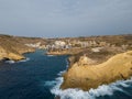 Xlendi tower with Xlendi bay aerial Gozo Malta scenic waves Royalty Free Stock Photo