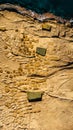 Aerial view of Xwejni Salt Pans,Xlendi Cliffs on Gozo island,Malta.Amazing natural creations from limestone.Traditional Sea-Salt Royalty Free Stock Photo