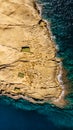 Aerial view of Xwejni Salt Pans,Xlendi Cliffs on Gozo island,Malta.Amazing natural creations from limestone.Traditional Sea-Salt Royalty Free Stock Photo