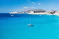 An aerial view of the yacht on the azure sea. Transparent clear water in the Mediterranean Sea. Summer vacations and travels on a Royalty Free Stock Photo