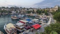 Aerial view of yacht harbor and red house roofs in "Old town" day to night timelapse Antalya, Turkey.