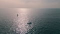 Aerial view yacht sailing. Boat floating on calm ripple ocean surface at summer