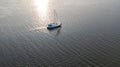 Aerial view of yacht sailing in Dnieper river on sunset Royalty Free Stock Photo