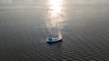 Aerial view of yacht sailing in Dnieper river on sunset Royalty Free Stock Photo