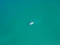 Aerial view yacht at sea in blue sea water texture