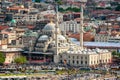 Aerial view of Yeni Cami mosque and Galata bridge during the day in Istanbul, Turkey